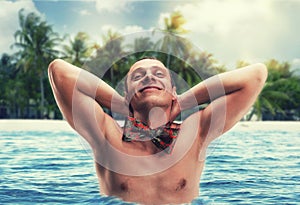 Confident young man in the sea