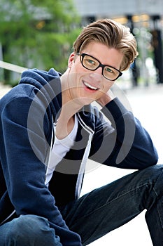 Confident young man smiling outdoors