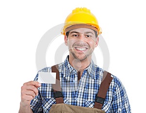 Confident young manual worker giving visiting card