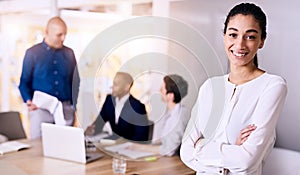 Confident young smiling business woman representing her multiethnic team photo