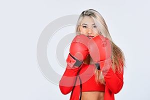 Confident young sportswoman posing in boxing gloves. beautiful woman with red boxing gloves. young sports woman in