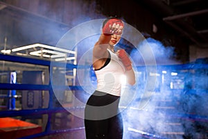 Confident young woman boxer training