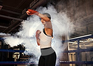 Confident young woman boxer training