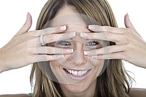 Confident Young Woman Peering Through Fingers