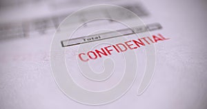 `Confidential` red stamp over a white background.