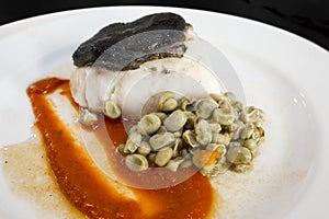 Confit of Cod Fillet, over Tomato Jam and Ali Oli of Black Garlic photo