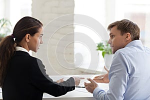 Conflict of female boss and male office worker photo