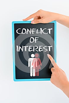 Conflict of interest concept on blackboard