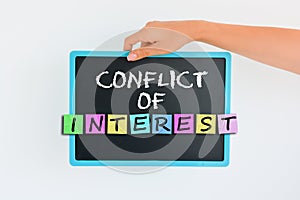 Conflict of interest concept on blackboard