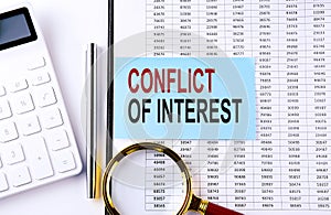 CONFLICT OF INTEREST on sticker on chart background, business concept