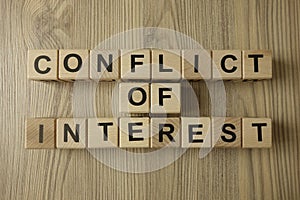 Conflict of interest text from wooden blocks