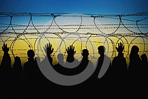 conflict russian rights human border wire barbed arms silhouette immigrants. seekers asylem Ukraine refugees Immigration