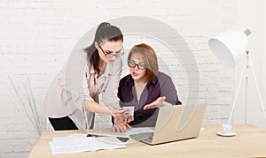 Conflict. Women discuss project in office