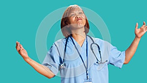 Conflicted nurse doing perplexed gesture