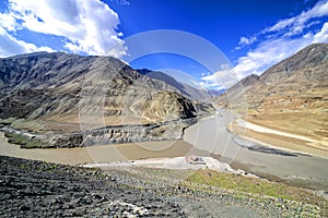 Confluence of Zanskar (from top) and Indus rivers near Nimmu, Ladakh photo