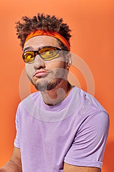 confused african american fella in eyeglasses photo