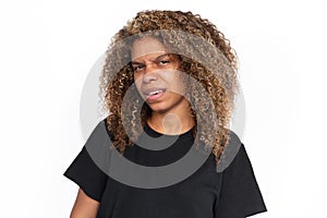 Confused African American woman frowning