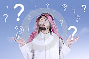 Confused Arabic man with question mark