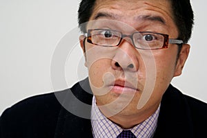 Confused asian businessman
