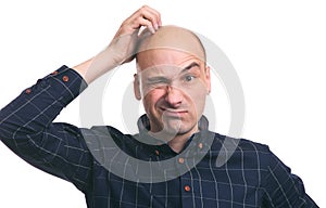 Confused bald guy scratch his head