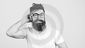 Confused bearded young man in glasses. Hipster trying to solve difficult problem. Bearded guy tries to gather with thoughts.