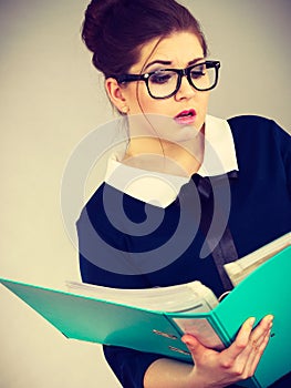 Confused business woman thinking about problem solution