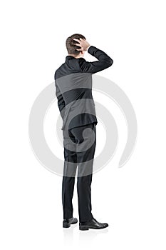 Confused businessman, rear view, isolated