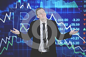 Confused caucasian businessman against declining bitcoin chart background