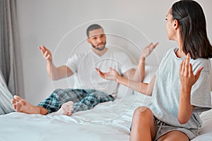 Confused, conflict and fight of couple in bedroom with doubt, liar and trust problem in marriage. Frustrated