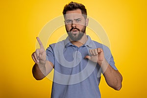 Confused displeased surprised caucasian man pointing fingers hisself, rejection, refusal, stop sign