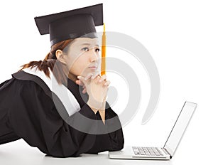 Confused female graduation thinking about job