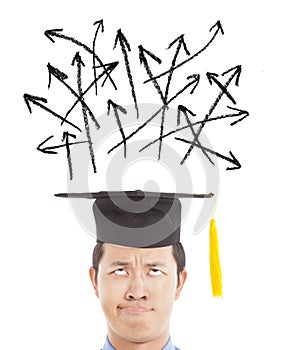 Confused graduate looking direction arrow