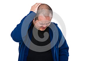 Confused man scratching head