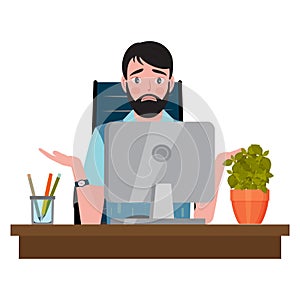 Confused man sitting on an office chair at a computer desk and looking at the monitor