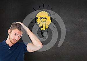 Confused man standing next to glowing light bulb icon