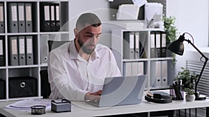 Confused Office Worker Doing Paperwork