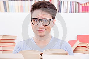 Confused student surrounded by books