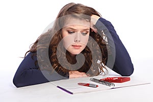 Confused teenager girl fed up with maths homework