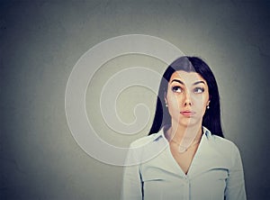 Confused thoughtful young woman making up her mind