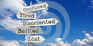 Confused, tired, disoriented, baffled, lost - wooden signpost with five arrows