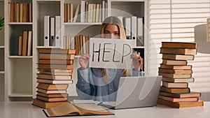 Confused tired student girl teen high school pupil exhausted stressed woman with books laptop studying in university