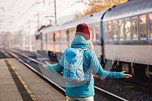 Confused tourist standing at wrong railway station platform