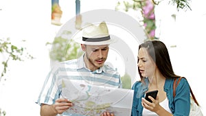 Confused tourists searching location on vacation