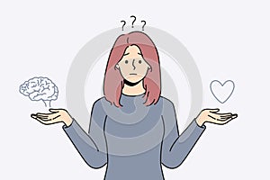 Confused woman choose between heart and brain