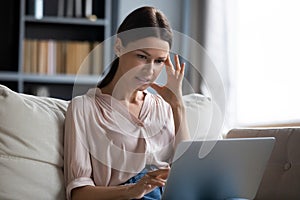 Confused woman frustrated with computer malfunction problems