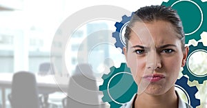 Confused woman in an office with blue cogs