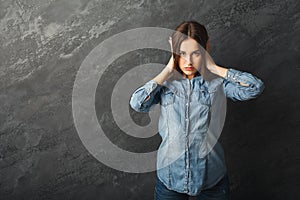 Confused woman puts her hands on the head