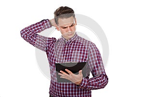 Confused young guy reading a document