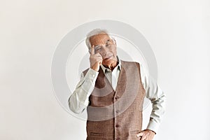 Confusing and forgetful elderly asian man with thinking gesture, Alzheimer`s disease.