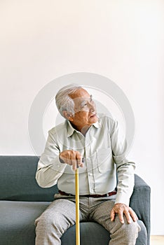 Confusing and forgetful elderly asian man with thinking gesture, Alzheimer`s disease.